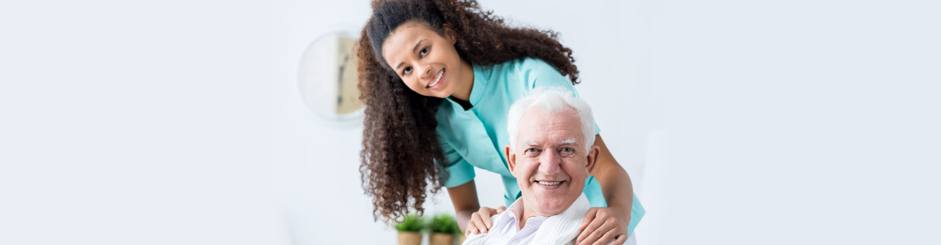 nurse hugging to senior man