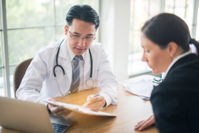 doctor and woman on the table