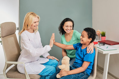 nurse and child smiling