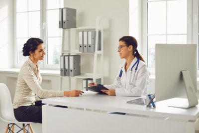 doctor taking on woman on table