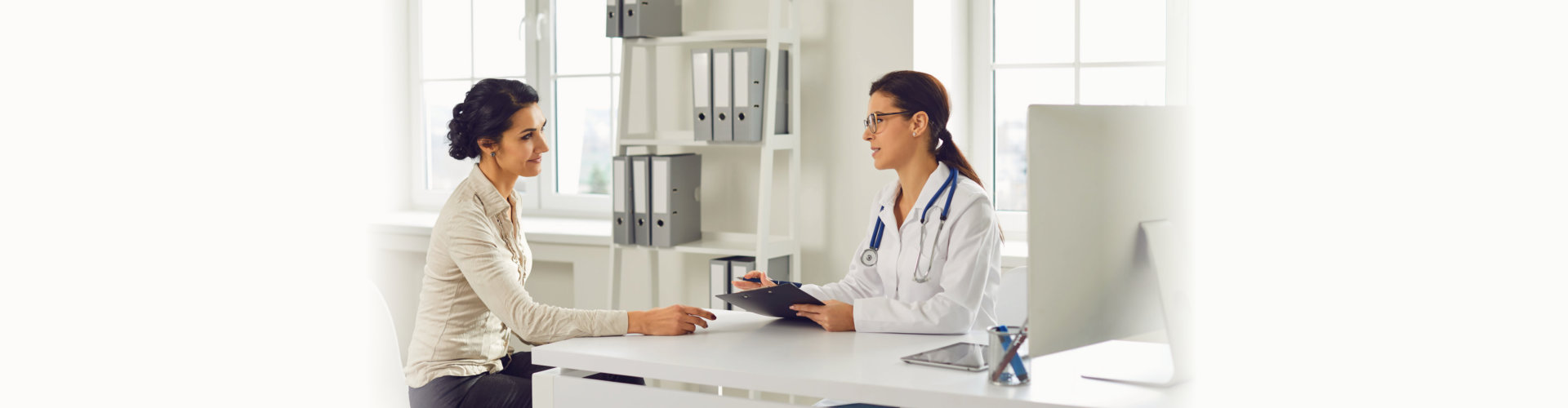 doctor taking on woman on table